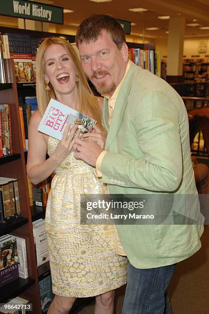 Alex McCord and Simon van Kempen from the cast of "Real Housewives of New York City" sign copies of "Little Kids, Big City" on April 23, 2010 in Boca...