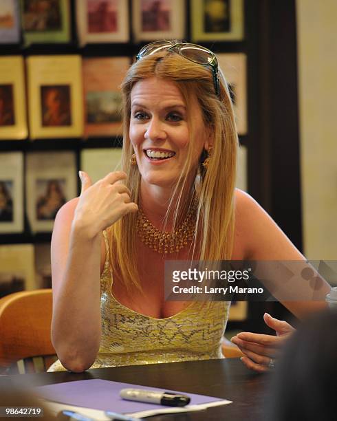 Alex McCord from the cast of "Real Housewives of New York City" signs copies of "Little Kids, Big City" on April 23, 2010 in Boca Raton, Florida.