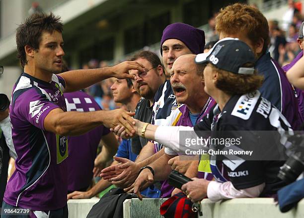 Cooper Cronk of the Storm shakes hands with fans during a Melbourne Storm NRL training session at AAMI Stadium on April 24, 2010 in Melbourne,...