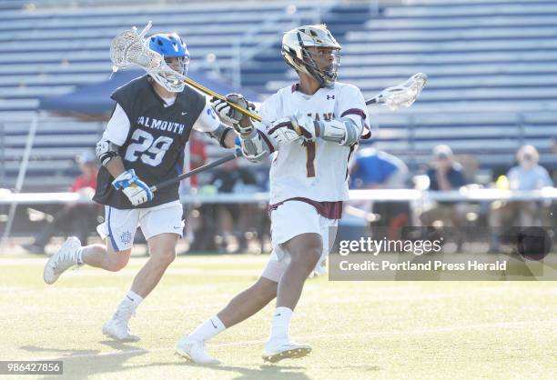 Thornton Academy's CJ LaBreck takes a shot on goal as Falmouth's Riley Reed moves in on defense Saturday, June 16, 2018.