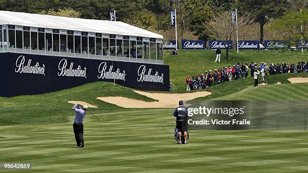 Graeme McDowell of Northern Ireland plays his second shot on the 10th hole during the Round Two of the Ballantine's Championship at Pinx Golf Club on...