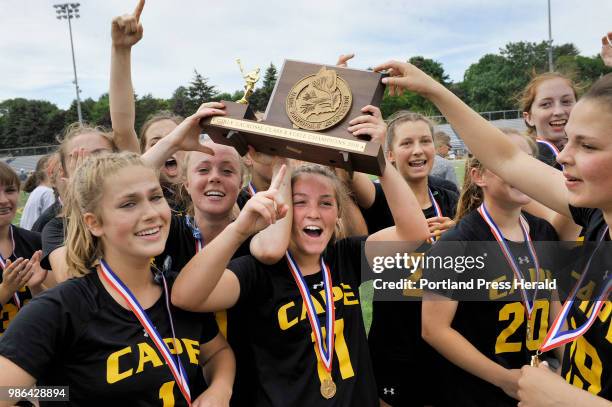The state class B Girls State championships lacrosse game between Cape Elizabeth and Yarmouth at Fitzpatrick Stadium. Cape's Cloe Chapin holds the...