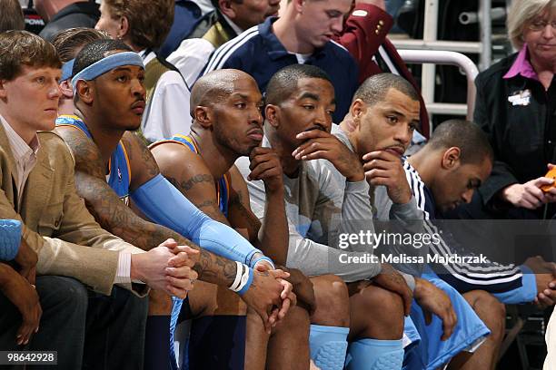 Carmelo Anthony, Chauncey Billups, J.R. Smith and Kenyon Martin of the Denver Nuggets sit the bench during the last minutes of play against the Utah...