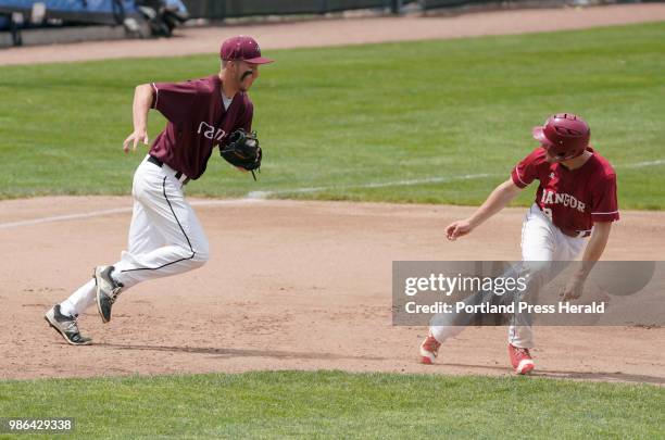 Gorham third baseman Kyle King chases down Jacob Munroe of Bangor during the Class A state baseball championship at St. Joseph's College in Standish...