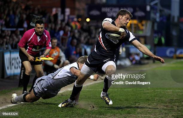 Mark Cueto of Sale is tackled by Charlie Amesbury during the Guinness Premiership match between Sale Sharks and Newcastle Falcons at Edgeley Park on...