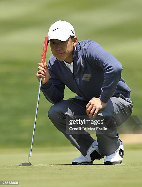 Anthony Kim of USA lines up a putt on the 14th green during the Round Two of the Ballantine's Championship at Pinx Golf Club on April 24, 2010 in...