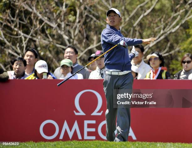 Anthony Kim of USA tosses his club after tee off on the 16th hole during the Round Two of the Ballantine's Championship at Pinx Golf Club on April...