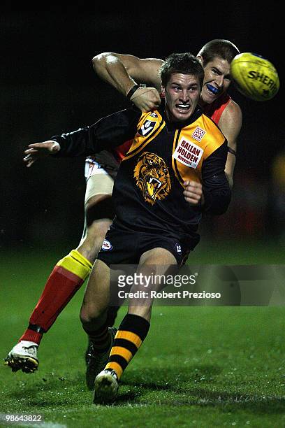 Ben Ross of the Tigers is pressured during the round three VFL match between the Werribee Tigers and the Gold Coast at Chirnside Park on April 24,...