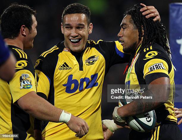 Ma'a Nonu of the Hurricanes is congratulated by Tamati Ellison after scoring the winning try during the round 11 Super 14 match between the...