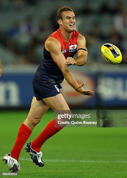 Brad Green of the Demons handballs during the round five AFL match between the Melbourne Demons and the Brisbane Lions at Melbourne Cricket Ground on...