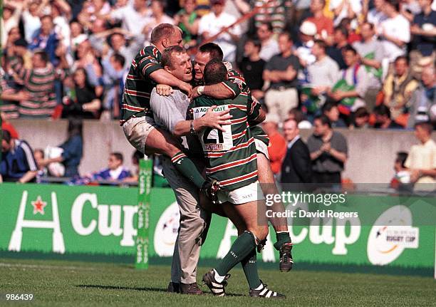 Leicester Coach Dean Richards celebrates his teams win with Pat Howard, Neil Back and Lewis Moody after the match between Stade Francais v Leicester...