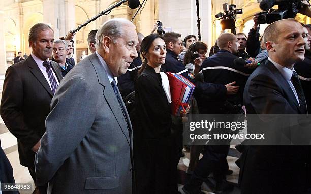 Former French Interior minister Charles Pasqua arrives with one of his lawyer Jacqueline Laffont at Paris' special court on April 19, 2010 to attend...