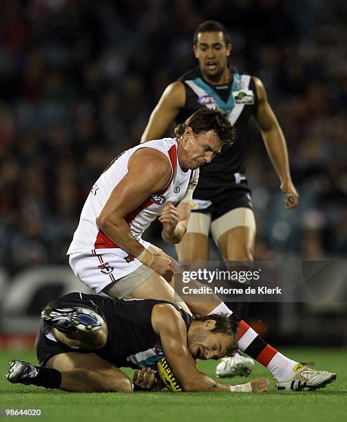 Tom Logan of the Power clashes with Justin Koschitze of the Saints during the round five AFL match between the Port Adelaide Power and the St Kilda...