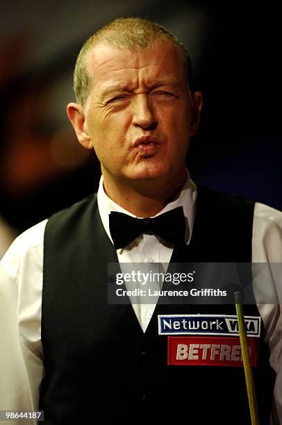 Steve Davis of England gestures in his match against John Higgins of Scotland during the Betfred.com World Snooker Championships at the Crucible...