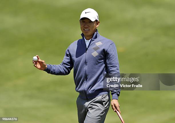 Anthony Kim of USA acknowledges to the crow on the 12th green during the Round Two of the Ballantine's Championship at Pinx Golf Club on April 24,...