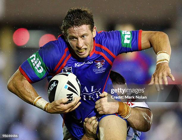 Kurt Gidley of the Knights is tackled during the round seven NRL match between the Cronulla Sharks and the Newcastle Knights at Toyota Stadium on...