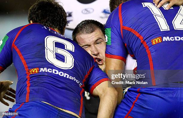 Paul Gallen of the Sharks is tackled during the round seven NRL match between the Cronulla Sharks and the Newcastle Knights at Toyota Stadium on...