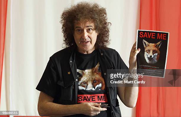Brian May, founding member of the rock band Queen, holds up a anti-fox hunting poster at the Royal British Legion on April 24, 2010 in Keynsham,...