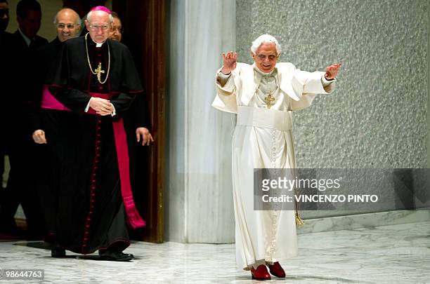 Pope Benedict XVI waves to faithful prior to an audience with participants of "Digital witness" meeting organised by the CEI in the Sala Nervi at...