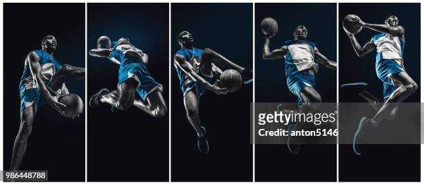 der afrikanische mann-basketball-spieler mit ball springen - basketball uniform stock-fotos und bilder