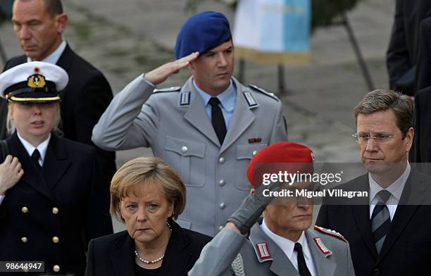 German Chancellor Angela Merkel and German Foreign Minister Guido Westerwelle attend a funeral service for four killed German ISAF soldiers at the...