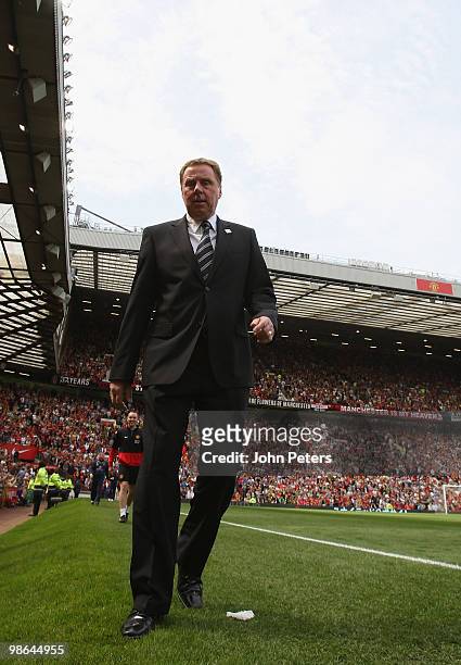 Harry Redknapp of Tottenham Hotspur walks to the bench ahead of the Barclays Premier League match between Manchester United and Tottenham Hotspur at...