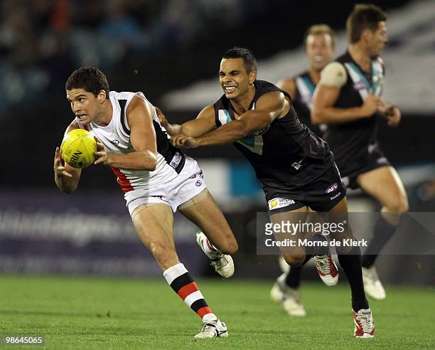 Danyle Pearce of the Power tackles Leigh Montagna of the Saints during the round five AFL match between the Port Adelaide Power and the St Kilda...