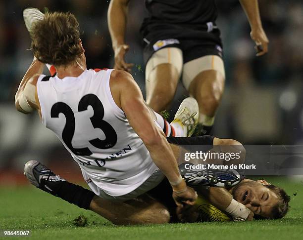 Tom Logan of the Power clash with Justin Koschitze of the Saints during the round five AFL match between the Port Adelaide Power and the St Kilda...