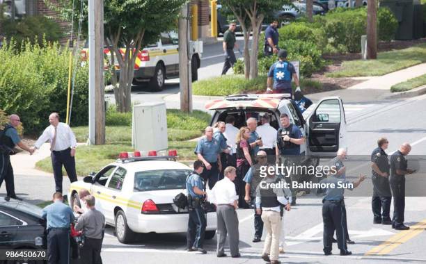 The scene outside 888 Bestgate, where an active shooter was in the Capital Gazette Newspaper office/newsroom, with heavy police, fire, and rescue...