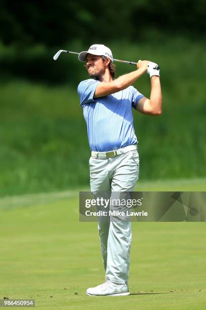 Aaron Baddeley of Australia plays a shot on the sixth hole during the first round of the Quicken Loans National at TPC Potomac on June 28, 2018 in...