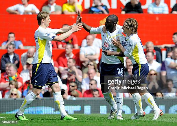 Ledley King of Tottenham Hotspur is congratulated by his team mates Roman Pavlyuchenko and Luka Modric after scoring an equalising goal during the...