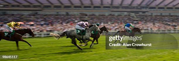 Mous Of Men and Timmy Murphy lead the field close home to win The bet365 Handicap Hurdle Race at Sandown racecourse on April 24, 2010 in Esher,...