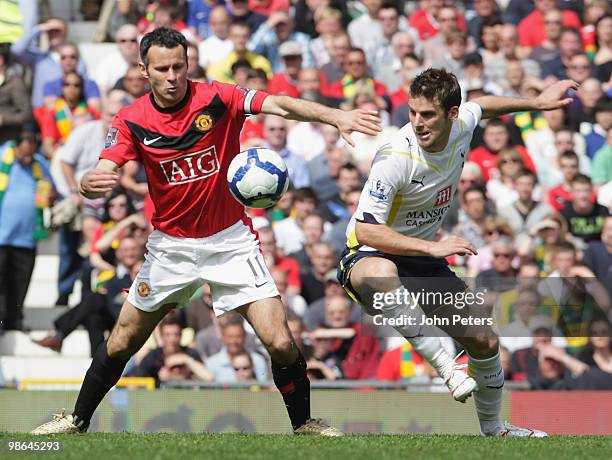 Ryan Giggs of Manchester United clashes with David Bentley of Tottenham Hotspur during the Barclays Premier League match between Manchester United...