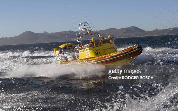 People stand on a rescue boat as the National Sea Rescue Institute , and the South Africa Air Force, joined forces on a 2010 World Cup preparation...