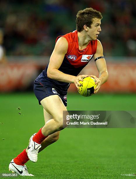 Jack Trengove of the Demons looks for a teammate during the round five AFL match between the Melbourne Demons and the Brisbane Lions at Melbourne...