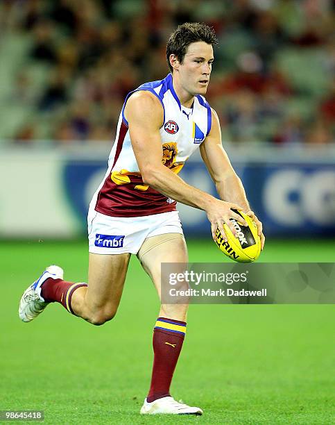 Andrew Raines of the Lions looks for a teammate during the round five AFL match between the Melbourne Demons and the Brisbane Lions at Melbourne...