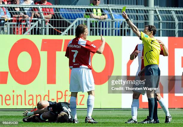 Eugen Polanski of Mainz receives the yellow card from referee Florian Meyer during the Bundesliga match between FSV Mainz 05 and Eintracht Frankfurt...