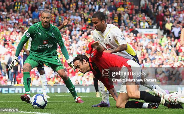 Dimitar Berbatov of Manchester United clashes with Aaron Lennon of Tottenham Hotspur during the Barclays Premier League match between Manchester...