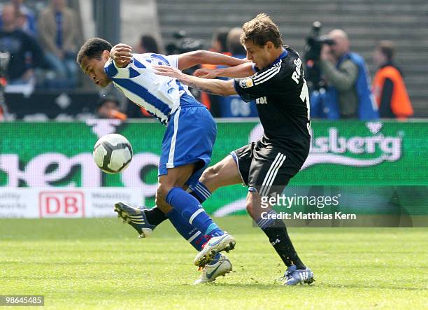 Raffael of Berlin battles for the ball with Rafinha of Schalke during the Bundesliga match between Hertha BSC Berlin and FC Schalke 04 at Olympic...