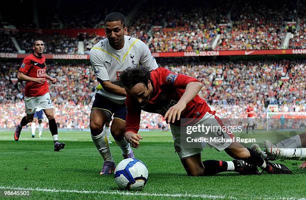 Aaron Lennon of Tottenham Hotspur tangles with Dimitar Berbatov of Manchester United during the Barclays Premier League match between Manchester...