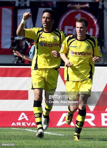 Lucas Barrios of Dortmund celebrates his team's first goal with team mate Kevin Grosskreutz during the Bundesliga match between 1. FC Nuernberg and...