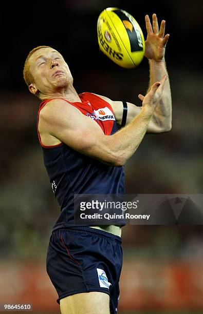 Matthew Bate of the Demons marks during the round five AFL match between the Melbourne Demons and the Brisbane Lions at Melbourne Cricket Ground on...