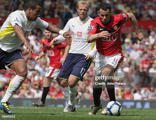 Ryan Giggs of Manchester United clashes with Tom Huddlestone of Tottenham Hotspur during the Barclays Premier League match between Manchester United...