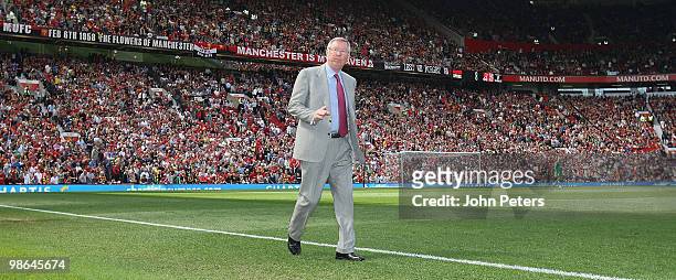 Sir Alex Ferguson of Manchester United walks to the dugout during the Barclays Premier League match between Manchester United and Tottenham Hotspur...