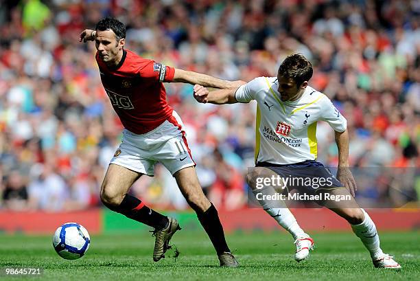 Ryan Giggs of Manchester United competes for the ball with David Bentley of Tottenham Hotspur during the Barclays Premier League match between...