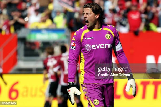 Goalkeeper Roman Weidenfeller of Dortmund reacts after Nuernberg scored his team's first goal during the Bundesliga match between 1. FC Nuernberg and...