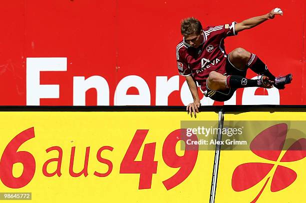 Mike Frantz of Nuernberg celebrates his team's first goal during the Bundesliga match between 1. FC Nuernberg and Borussia Dortmund at the Easy...