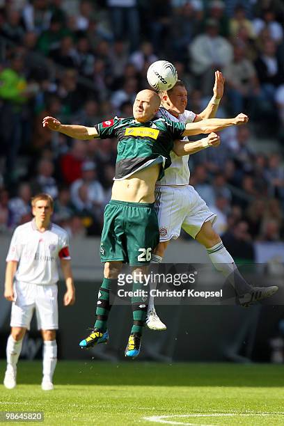 Michael Bradley of Gladbach and Bastian Schweinsteiger of Bayern go up for a header during the Bundesliga match between Borussia Moenchengladbach and...