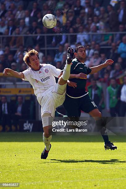 Holger Badstuber of Muenchen challenges Raul Bobadilla of Moenchengladbach during the Bundesliga match between Borussia Moenchengladbach and FC...