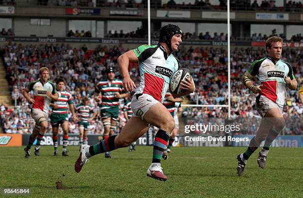 George Lowe of Harlequins races clear to score a try during the Guinness Premiership match between Leicester Tigers and Harlequins at Welford Road on...